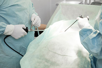 Surgeons with laparoscopic surgery tools