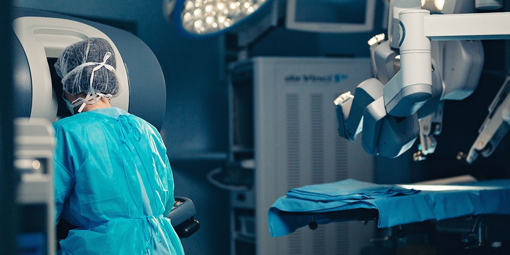 Surgeon at machine for robotic surgery